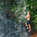 Man in waterfall